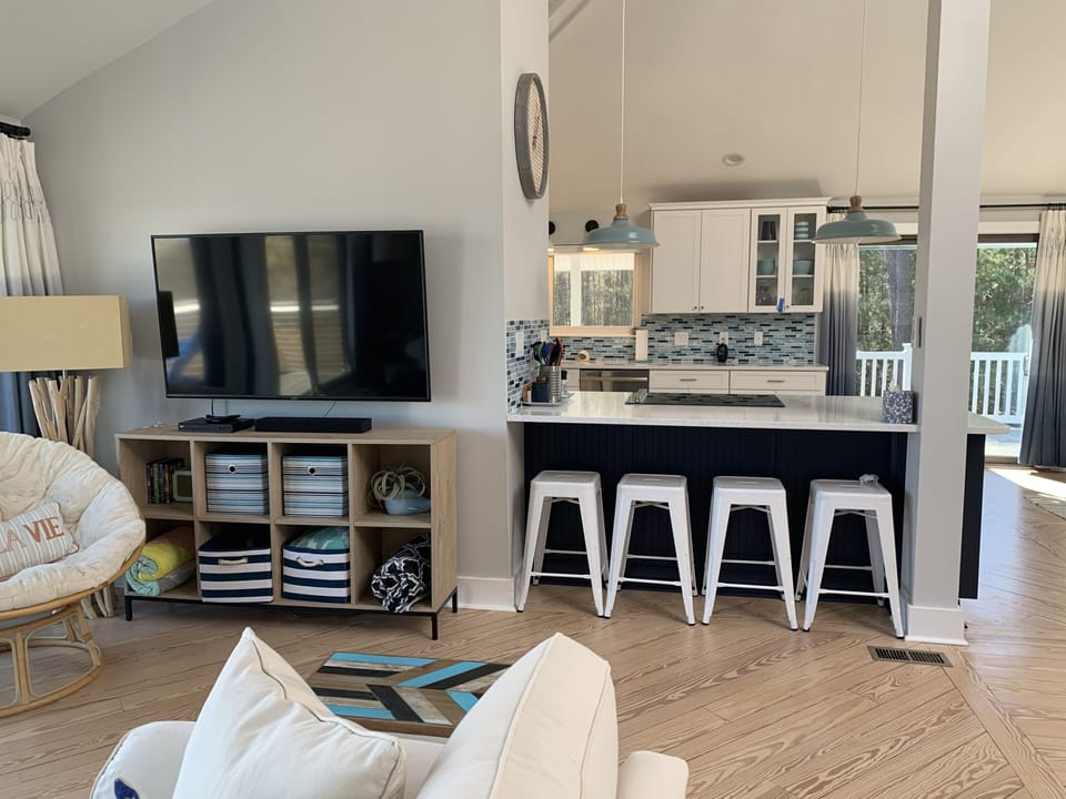 View from living room into kitchen and side deck