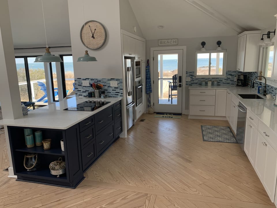 Large modern kitchen with bay and pond views