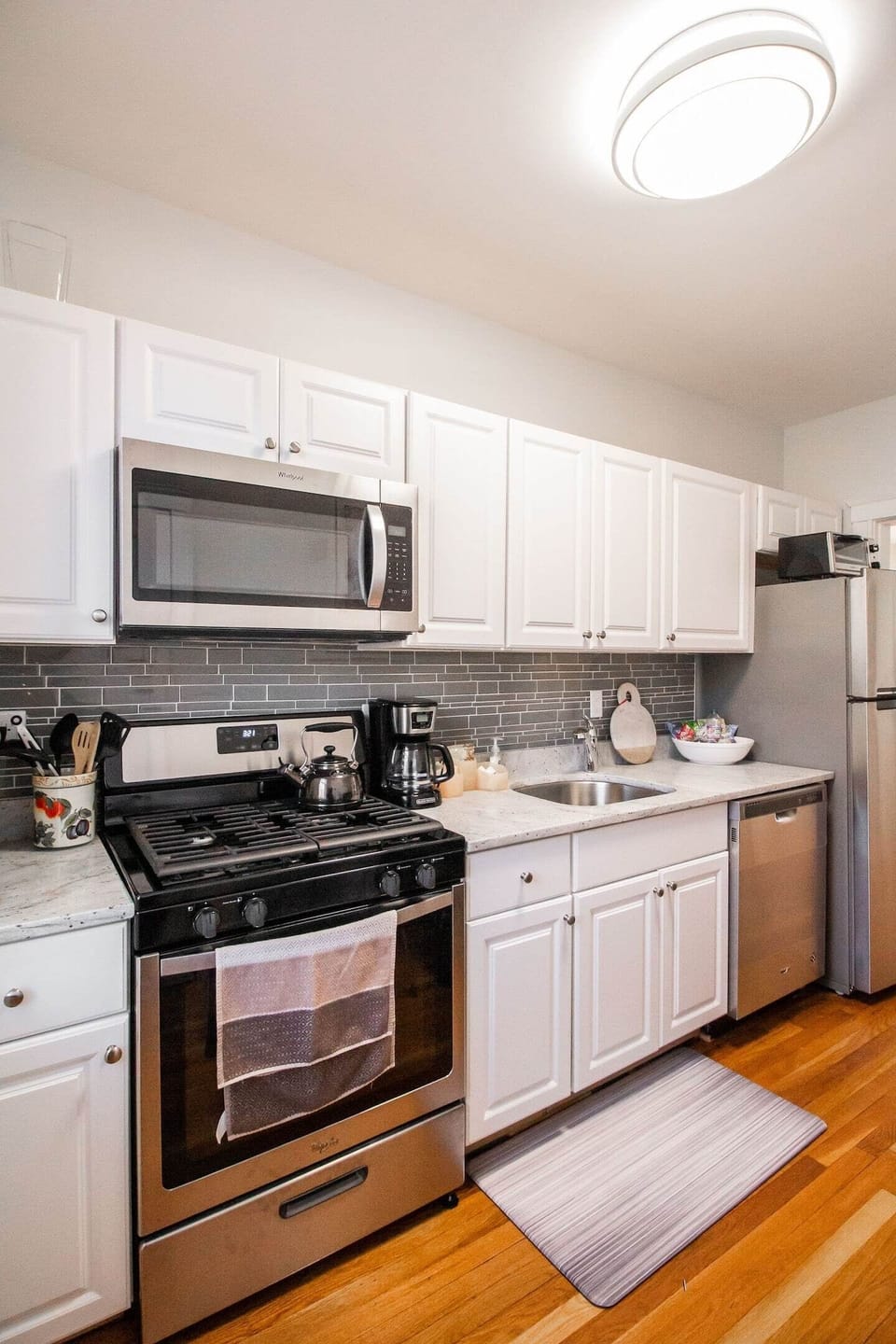 New Gas Range, Microwave, and Dishwasher all in kitchen