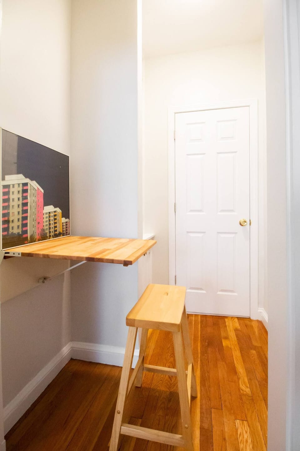 Fold out desk in short hallway.