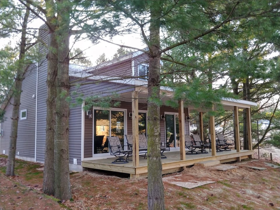 Wrap around covered porch facing the lake.
