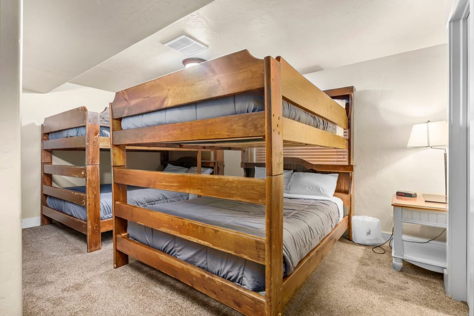 The basement bunk room. Four queen beds make it perfect for sleeping groups. 