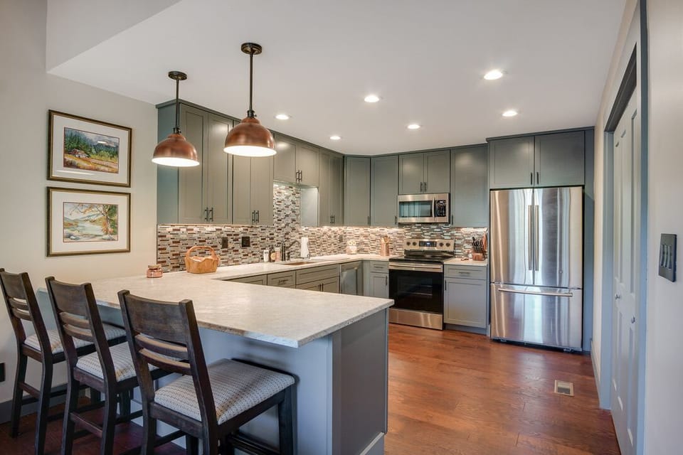 Well appointed kitchen. Full-size washer/dryer in laundry room on the right.