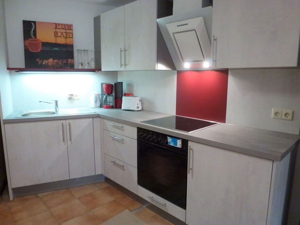 Property, Countertop, Room, Kitchen, Cabinetry, Furniture, Building, Kitchen Stove, Major Appliance, Interior Design