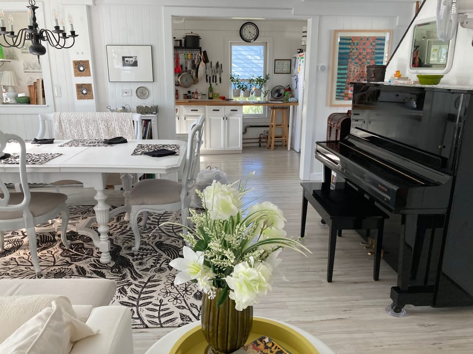 Dining area to kitchen  view to piano