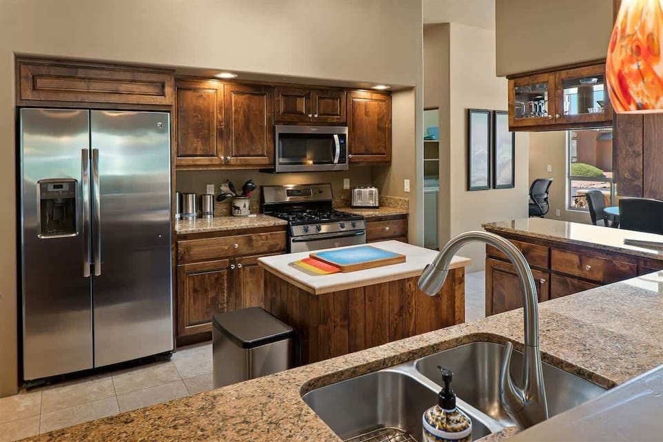 Fully equipped kitchen with stainless steel appliances and all your cooking needs