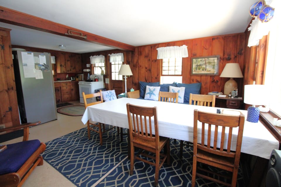 Dining Space with Couch and Kitchen in Background