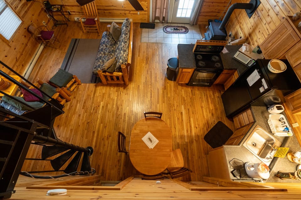 Looking down from loft into kitchen and living room 