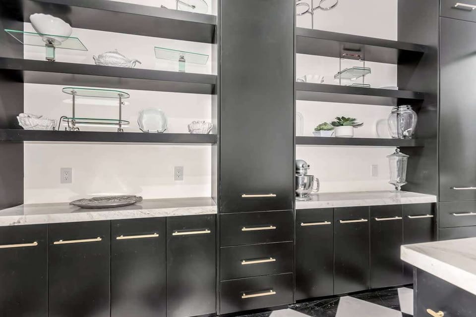 2nd Kitchen area featuring stainless steel appliances and a wine rack.