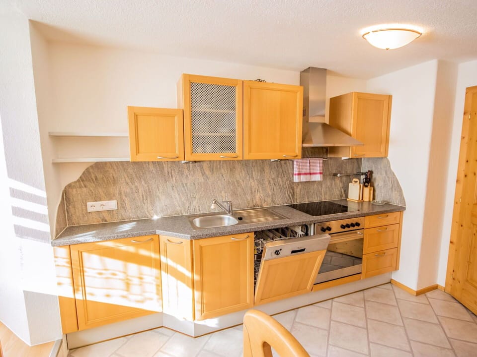 Furniture, Room, Property, Kitchen, Cabinetry, Yellow, Interior Design, Countertop, Floor, Building