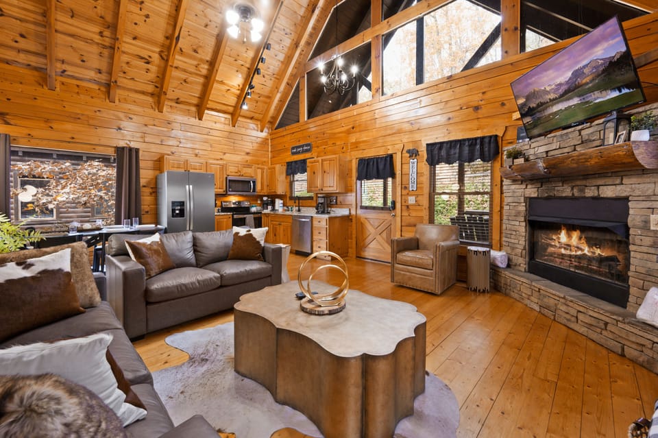 Living room with lots of window that maximize sunlight. It's a beautiful space.