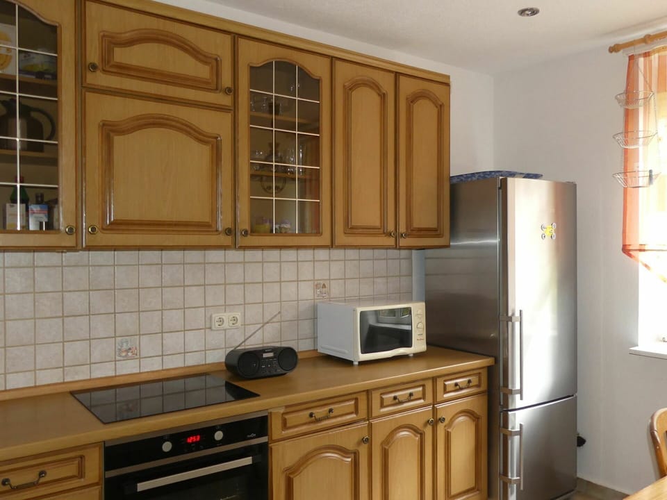 Brown, Countertop, Cabinetry, Property, Furniture, Building, Kitchen Stove, Kitchen Appliance, Kitchen, Wood