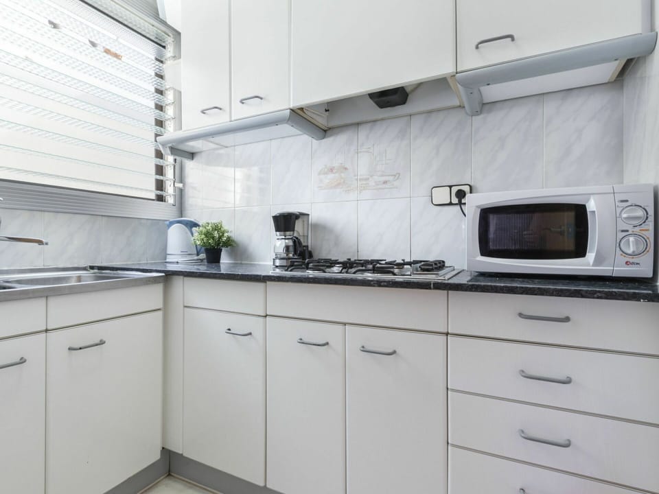 Countertop, Cabinetry, Kitchen, Room, White, Property, Furniture, Tile, Interior Design, Kitchen Stove