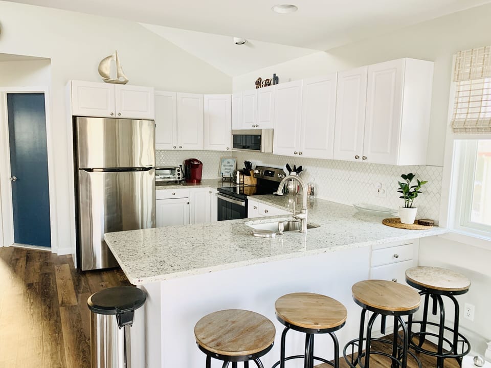 Open concept, eat in Kitchen. New appliances and granite + counter seating! 