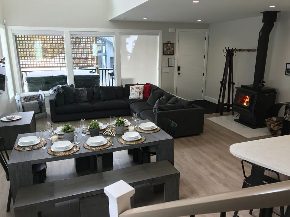 The great room featuring transformer table expanding to seat up to 12 guests 