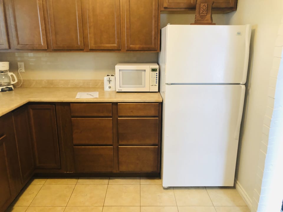 Full size fridge and lots of cupboard space

