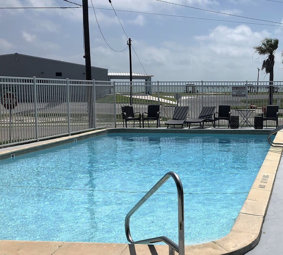 Sparkling pool, facing the bay, is just outside - enjoy!
