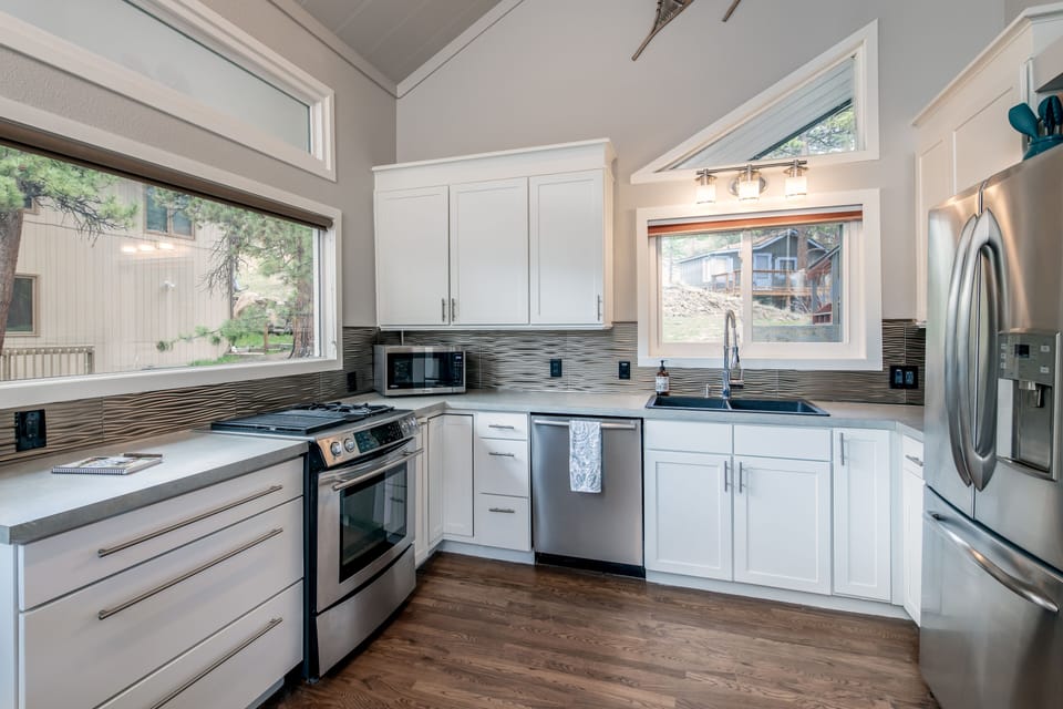 Large kitchen with gas stove, electric oven and fully stocked essentials.