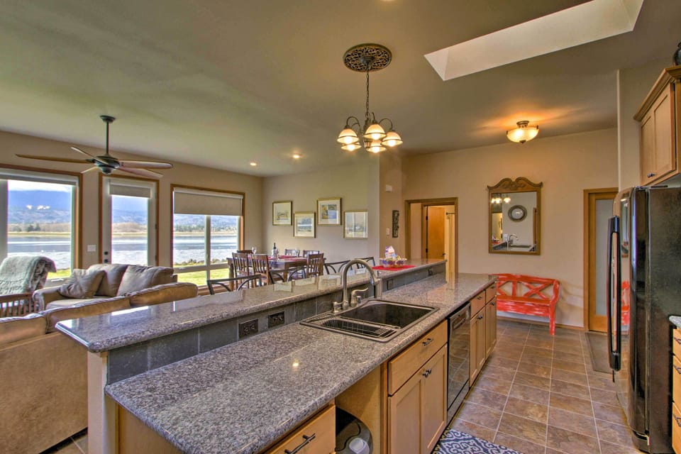 Sit at the breakfast bar and sip a cup of coffee from the drip coffee maker.