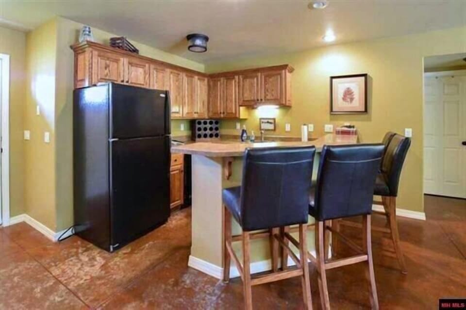 The bottom floor in the main house has a refrigerator, ice maker and a sink. 