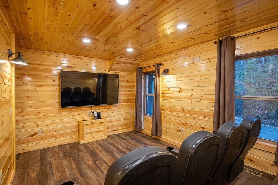Private theater room w/seating for nine w/85" smart TV. 