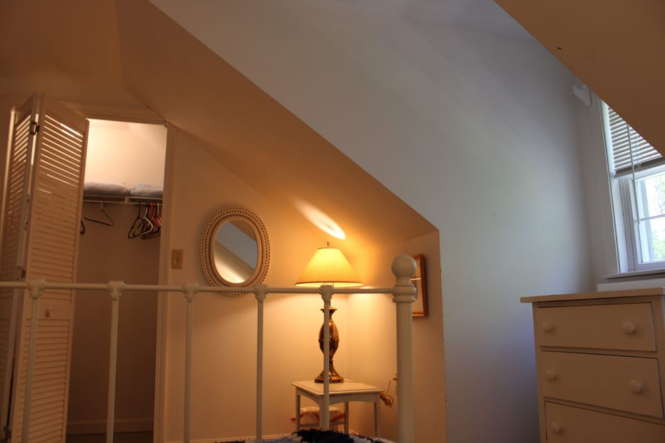 The blue room is a quiet space with a large closet and a lakeview.