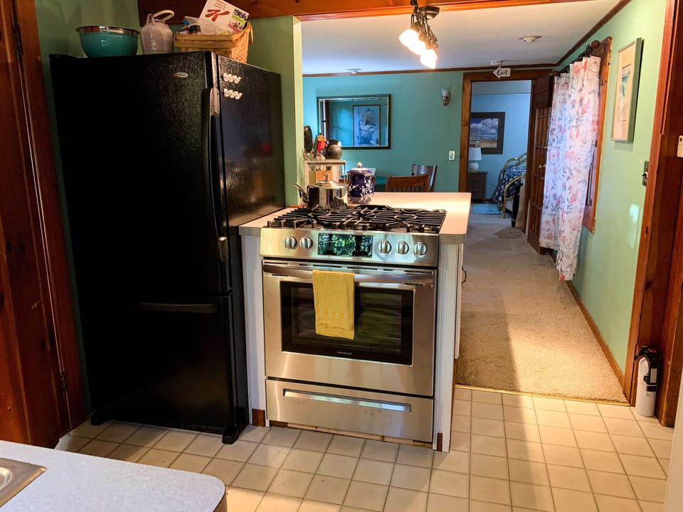 New kitchen appliances, dining room and main bedroom, looking North