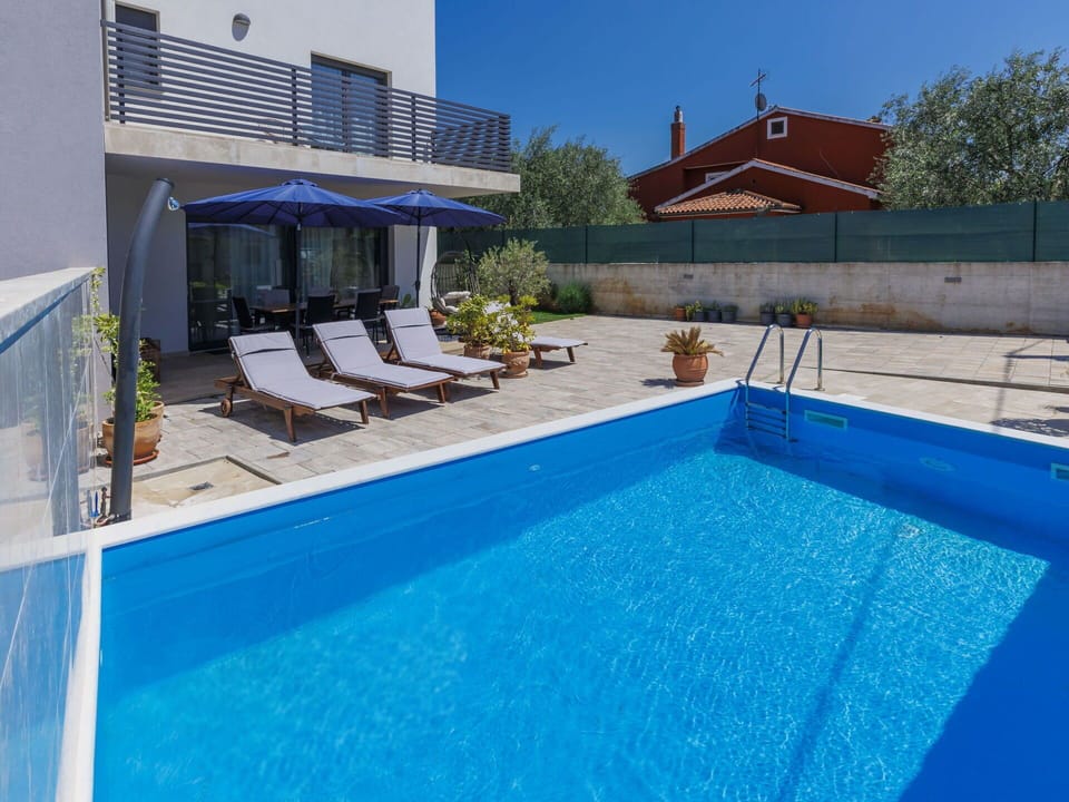 Water, Property, Swimming Pool, Sky, Plant, Azure, Blue, Shade, Outdoor Furniture, Body Of Water