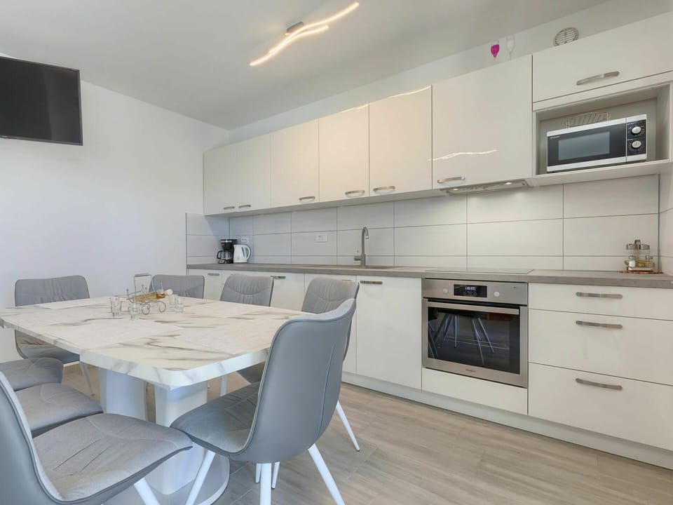 Furniture, Cabinetry, Property, Countertop, Table, Chair, Building, Kitchen, Kitchen Stove, Wood