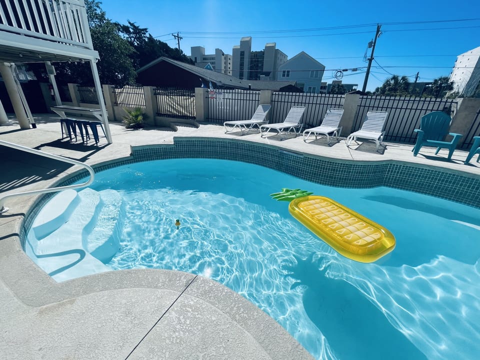 Huge pool with sitting ledges to relax.  Large, fenced in backyard.  