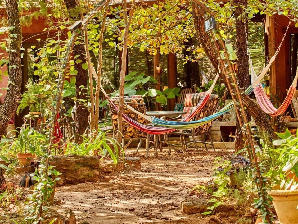 Lodge front yard is perfect spot to hang, chill ‘round table within view of outside living/pingpong, toddler play, rock climbing…