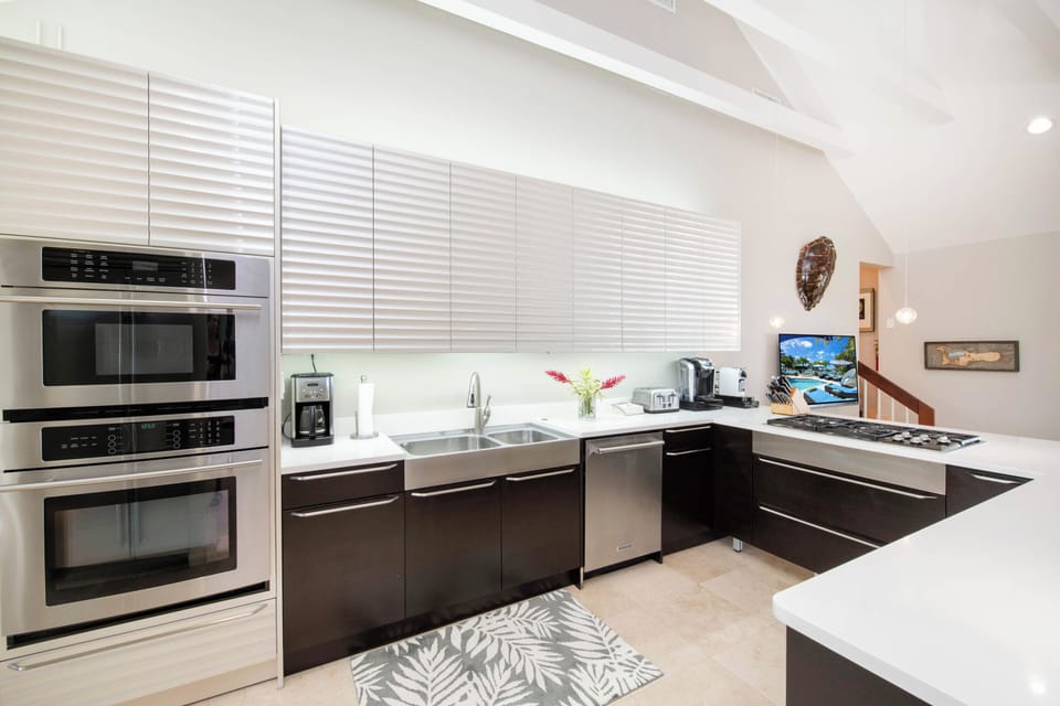 Gourmet kitchen with modern appliances and finishes. 