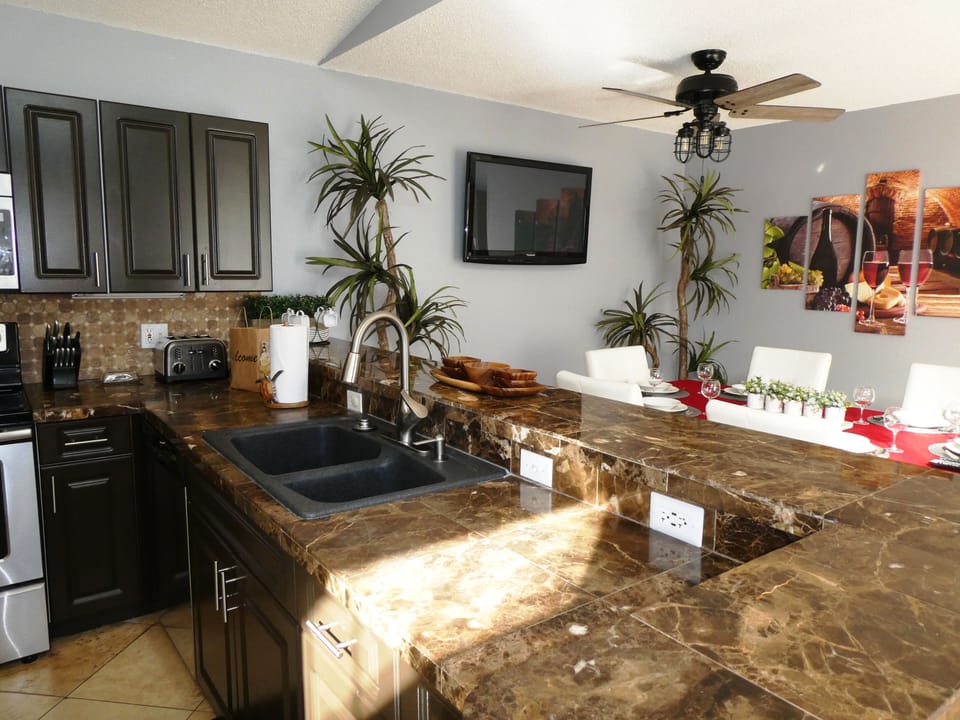 Well equipped kitchen open to the dining area 