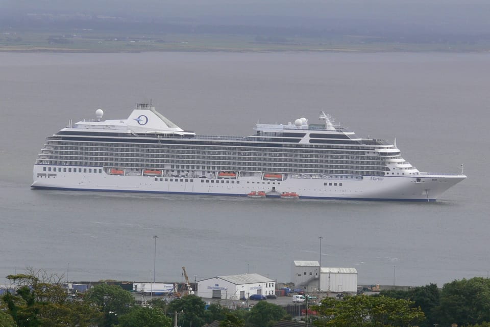 CRUISE SHIP ANCHORED OFF THE HARBOUR