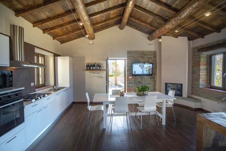 Spacious kitchen/ dining room leads to comfortable balcony & BBQ area