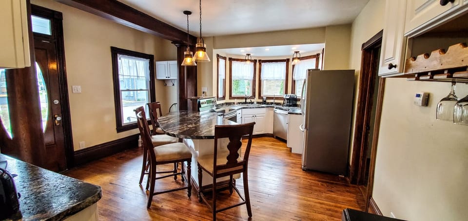 Kitchen Area - Main Level. Kitchen area with kitchen bar and seating for 4. It a great area to socialize while preparing meals.