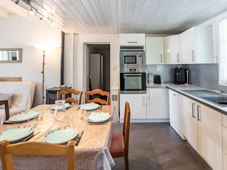 Table, Cabinetry, Furniture, Property, Countertop, Chair, Kitchen Appliance, Wood, Lighting, Kitchen Stove