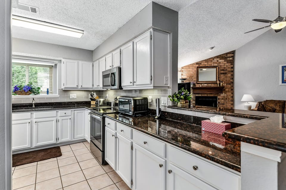 Bright and extensively provisioned kitchen
