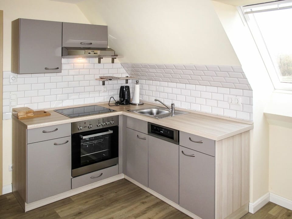 Countertop, Cabinetry, Room, Kitchen, Furniture, Property, Major Appliance, Interior Design, Kitchen Stove, Floor