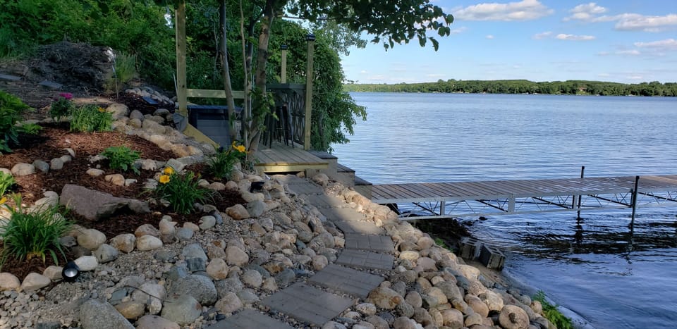beautiful lake side deck, dock area. Bin full of things for guests to use.
