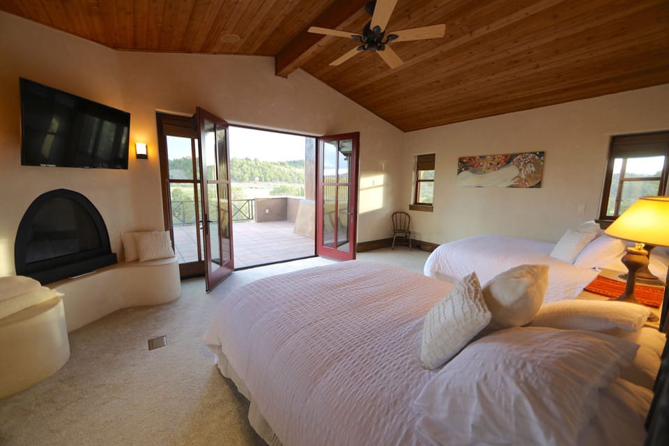 The second master suite has 2 queen beds and French doors leading to a balcony.