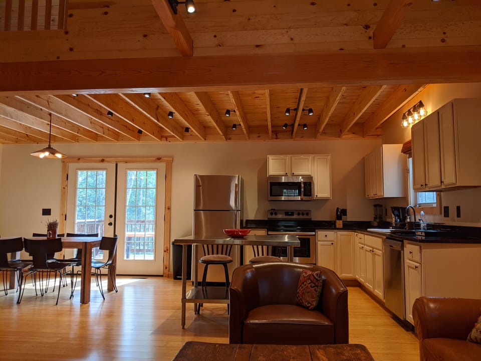 Open living room, kitchen and 6 person dining area