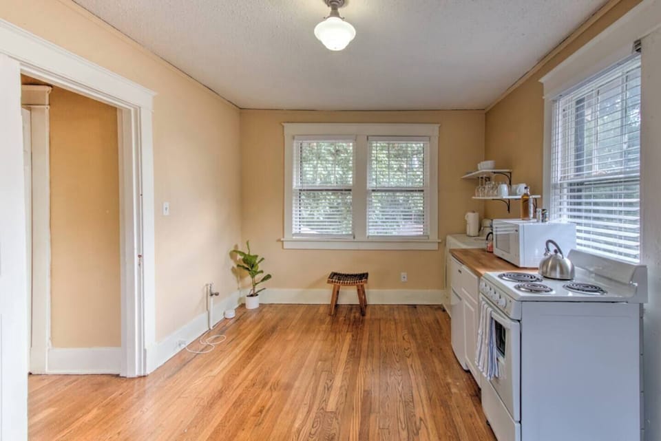 Well-stocked kitchen with refrigerator, stove, oven, microwave, and dishwasher.