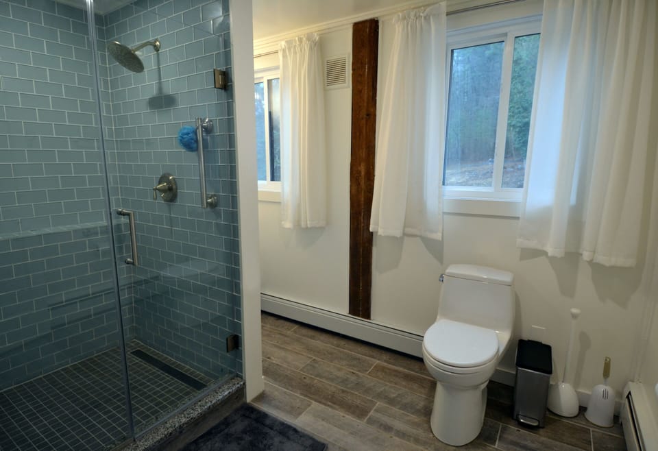 Accessible main level bathroom with grab bars (shower seat also available)