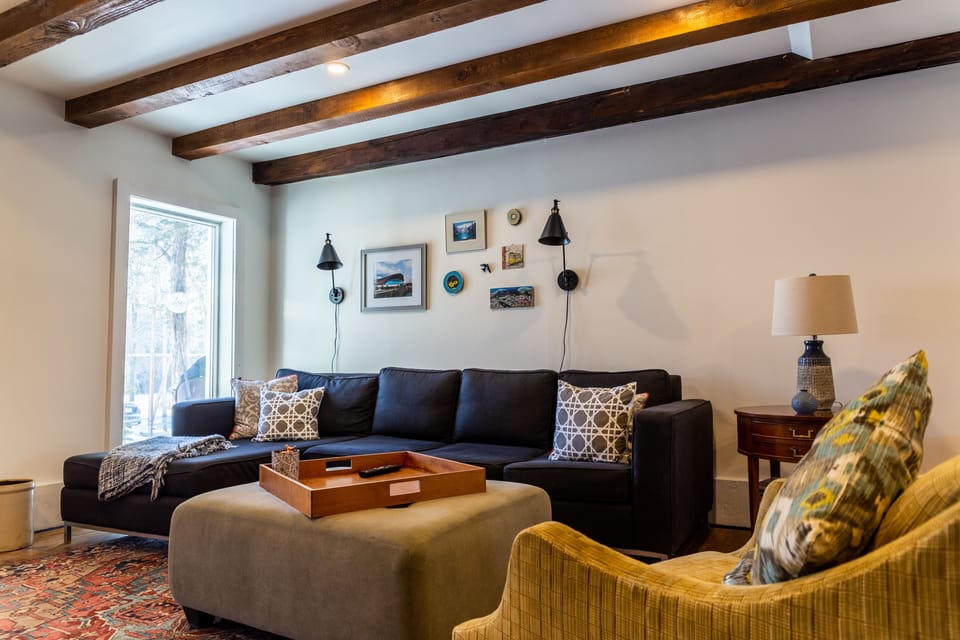 Large family room with sectional sofa and plenty of space to watch a movie.