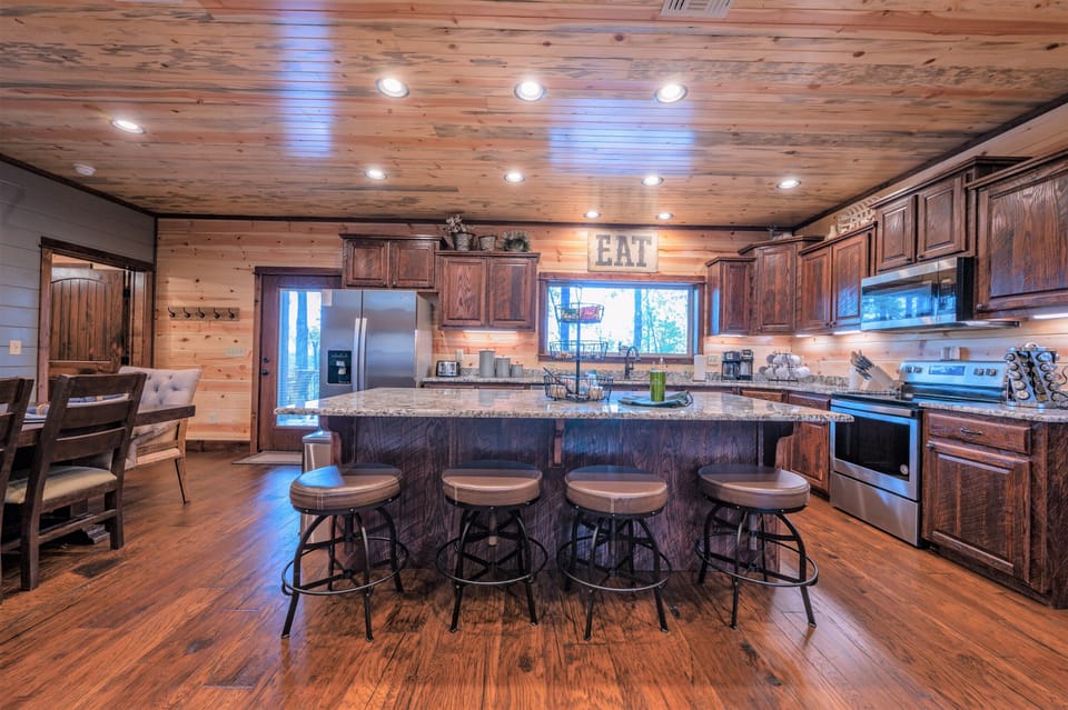 4 additional seats can be found at the bar top in the kitchen.