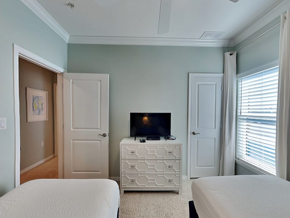 Third Bedroom - TV and Adjacent Hallway Full Bathroom - Third Floor