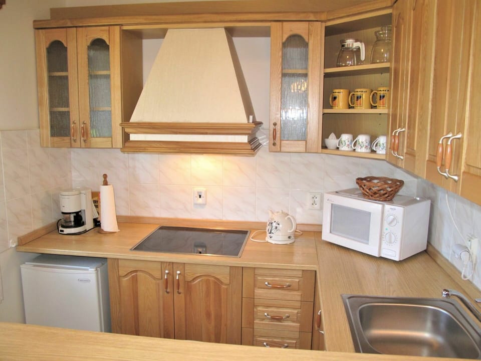 Countertop, Cabinetry, Sink, Room, Furniture, Kitchen, Property, Interior Design, Cupboard, Wood