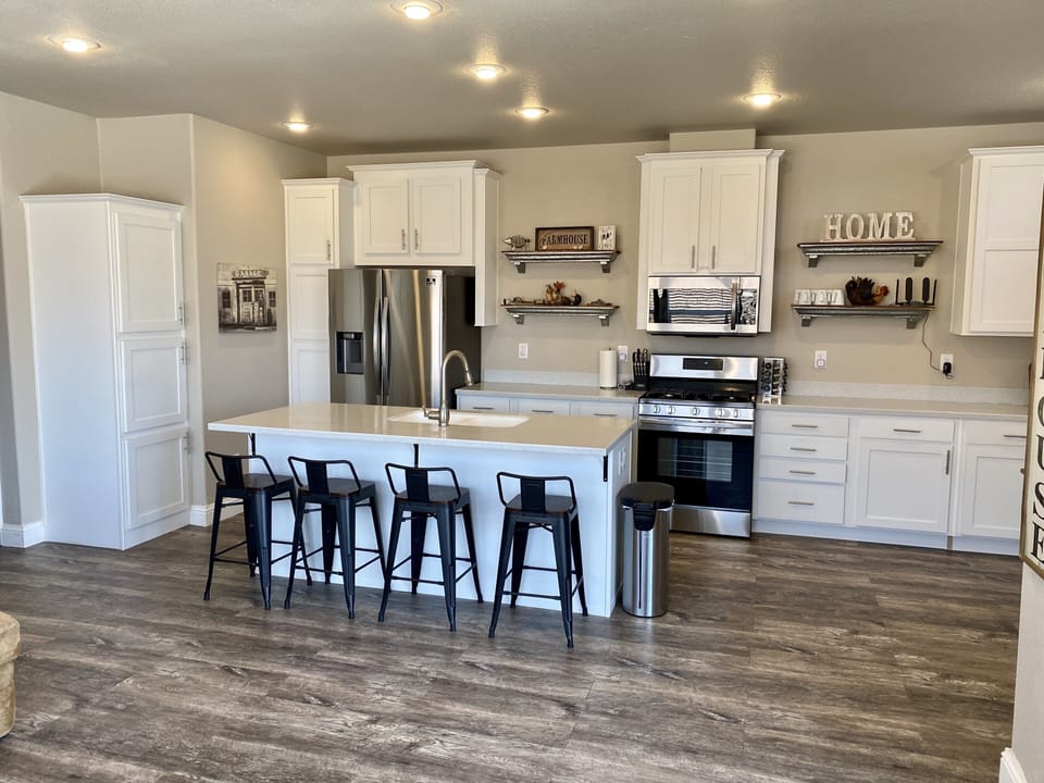 Large island and brand new Samsung appliances, kitchen comes with all utensils. 