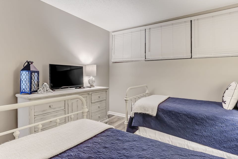 Twin Bedroom with TV and Dresser